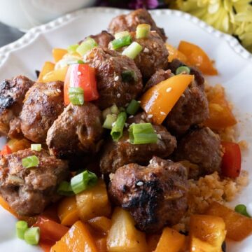 Sweet and Sour Meat Balls, a delicious meatball recipe that will have you making these over and over again! Dairy, Soy, and Gluten free you won’t want to miss this tasty healthy dinner! #meatballs #paleo #paleomeatballs #sweetandsour #glutenfree #dairyfree #soyfree #dinner #atablefullofjoy #asian #pork #baked