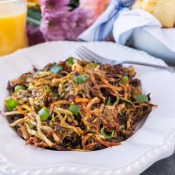 Zucchini Hash Browns are the perfect way to get some veggies in while still enjoying a favorite breakfast treat! These zucchini hash browns are so tasty you won’t even know there is zucchini in them! #healthy # veggie #hash brown #zucchini #forkids #glutenfree #atablefullofjoy #crispy #tasty #vegan #lowcarb