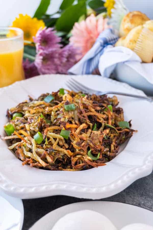 Zucchini Hash Browns are the perfect way to get some veggies in while still enjoying a favorite breakfast treat! These zucchini hash browns are so tasty you won’t even know there is zucchini in them! #healthy # veggie #hash brown #zucchini #forkids #glutenfree #atablefullofjoy #crispy #tasty #vegan #lowcarb