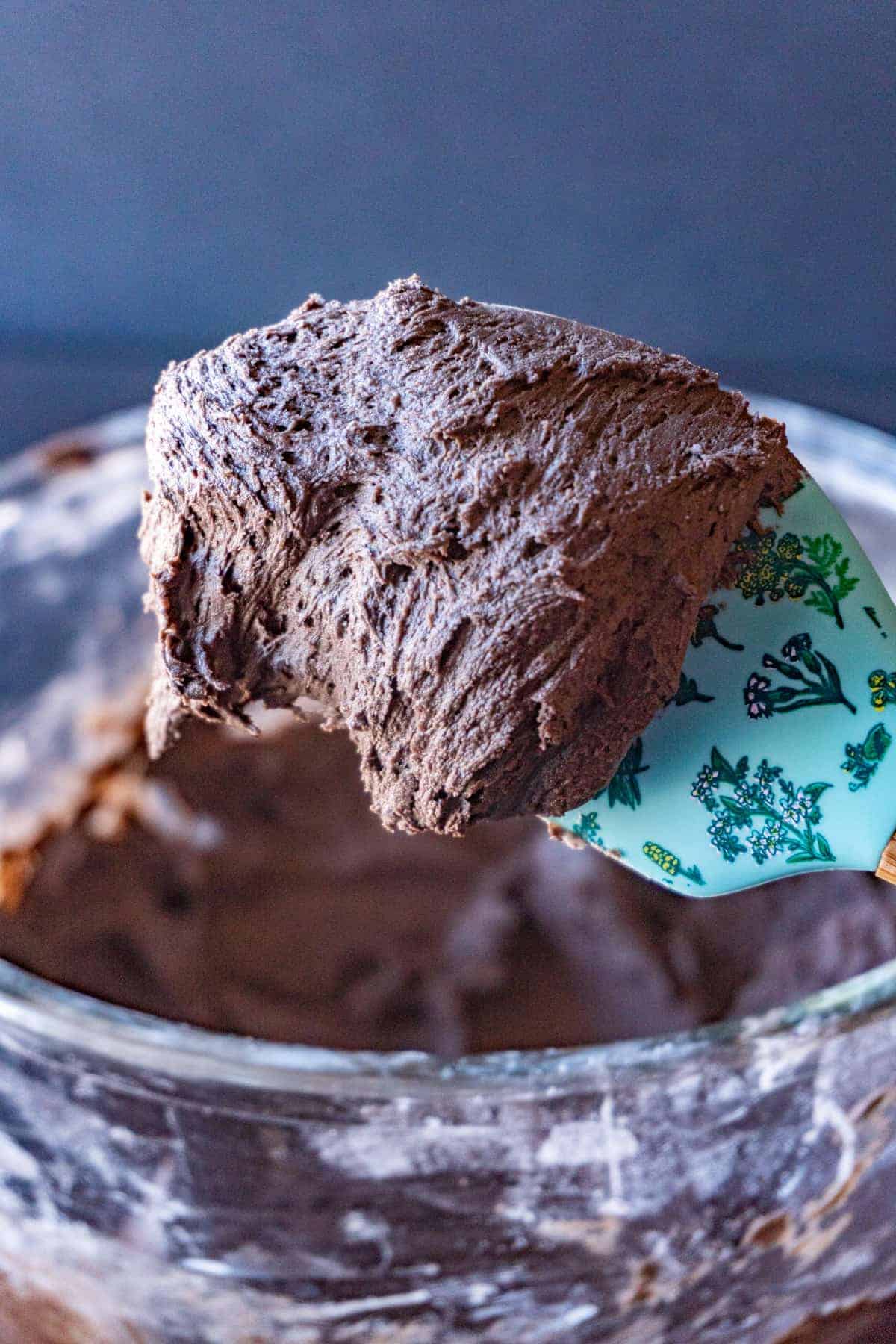 dark chocolate buttercream frosting on a spatula