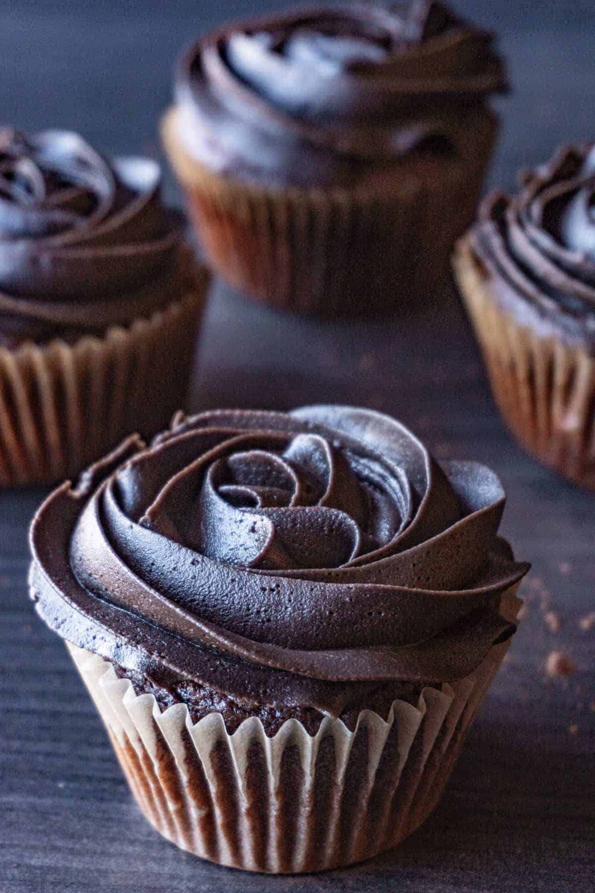 dark chocolate buttercream frosting on cupcake