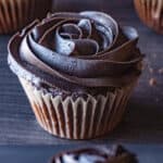 dark chocolate buttercream frosting swirled on top of cupcake featured image