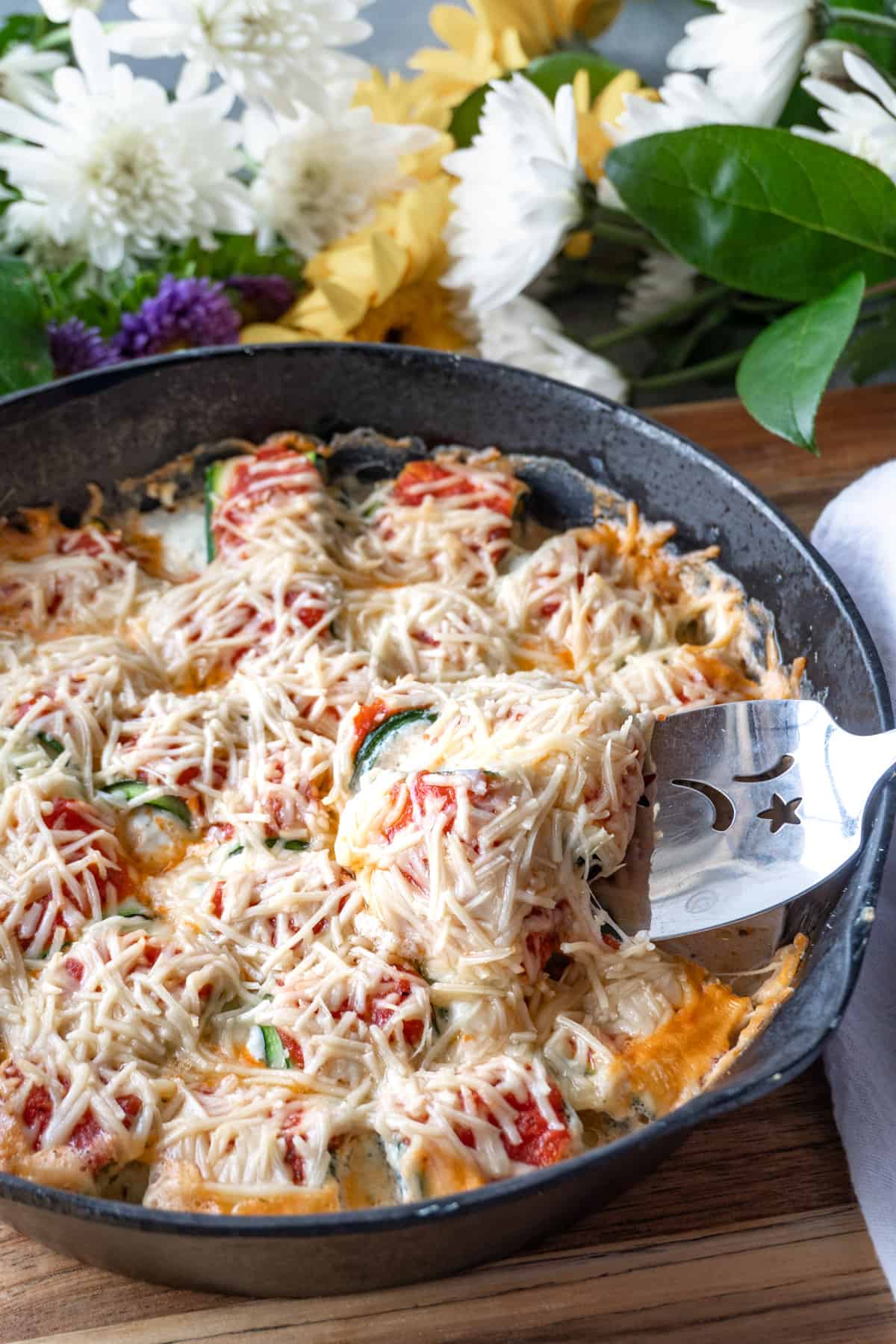 zucchini appetizer in pan with one on spatual