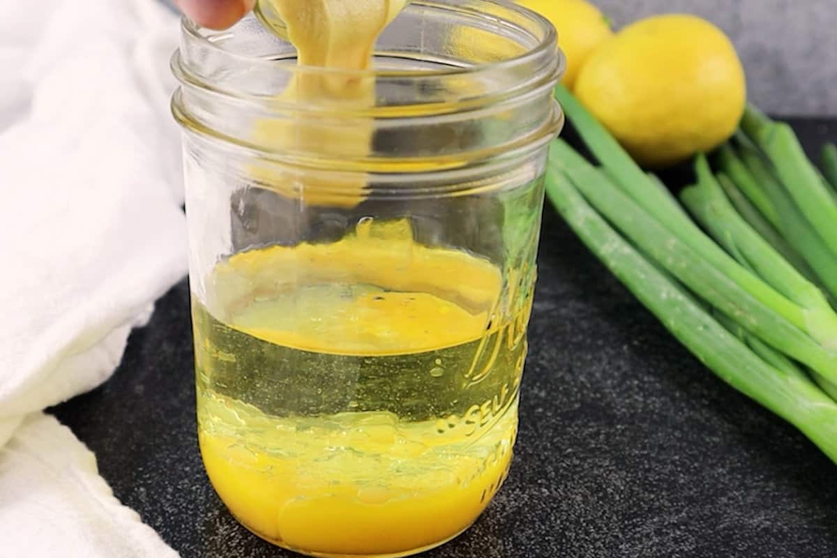 dijon mustard added to mason jar