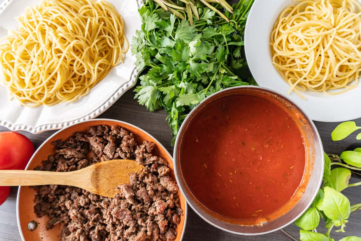 Pasta Marinara with noodles and ground beef all ins eparate dishes