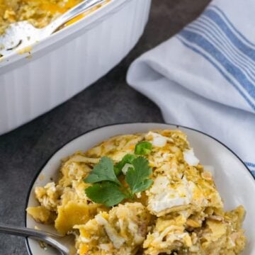 Shredded Chicken Enchiladas, a delicious and easy dinner that can be made in no time! #enchiladas #chicken #rotisserie #atablefullofjoy #leftover #easy #green #corntortillas #cassserole