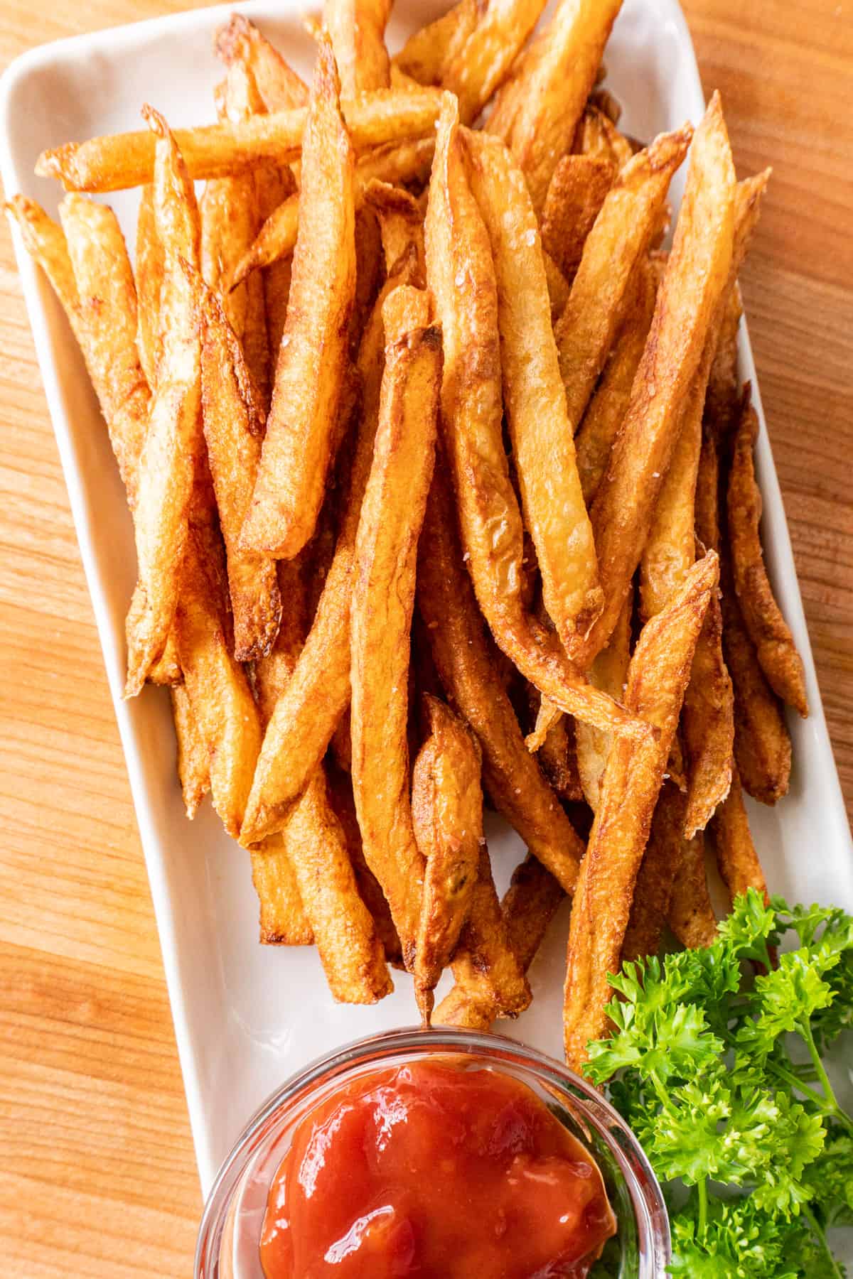 french fries on white platter