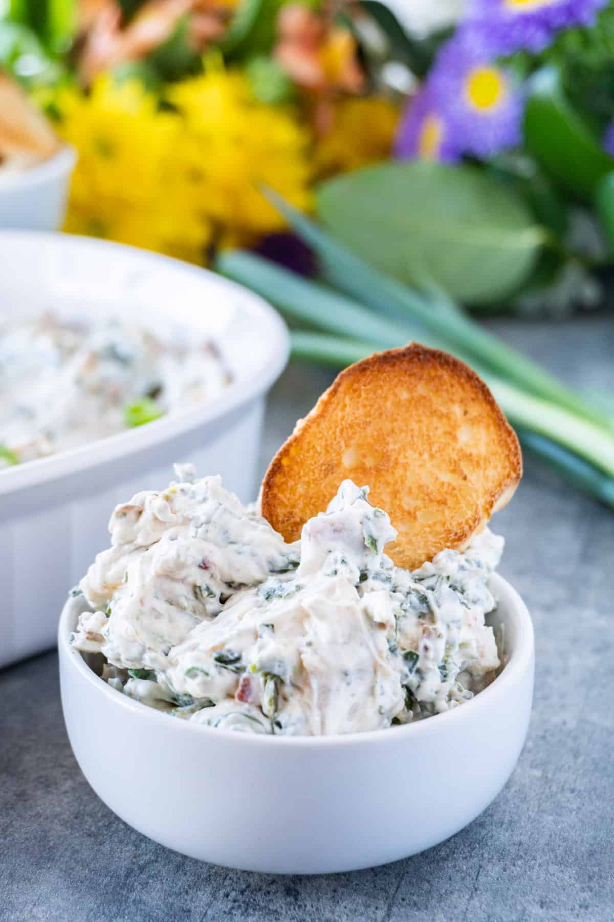 spinach dip close up with toasted bread