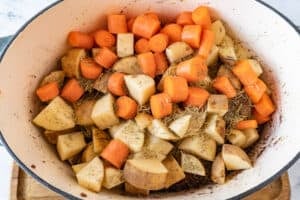 potatoes, onions, seasoning, and roast added to dutch oven