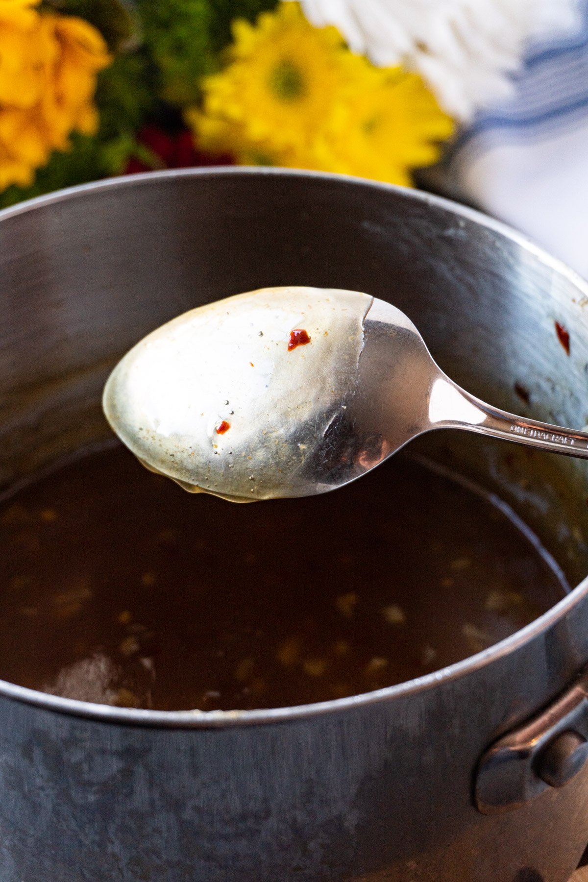 gyoza dipping sauce on back of spoon.