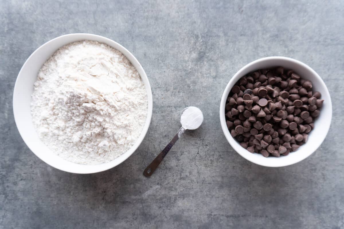 flour, baking soda, chocolate chips in bowls