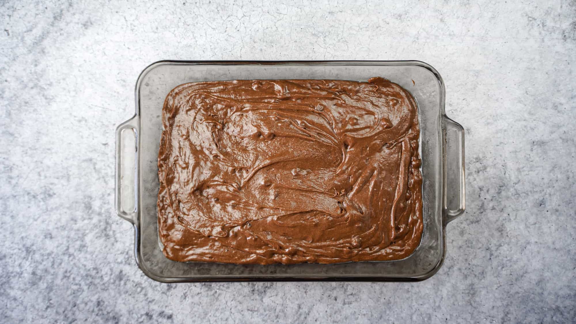 brownie batter in baking dish before baking