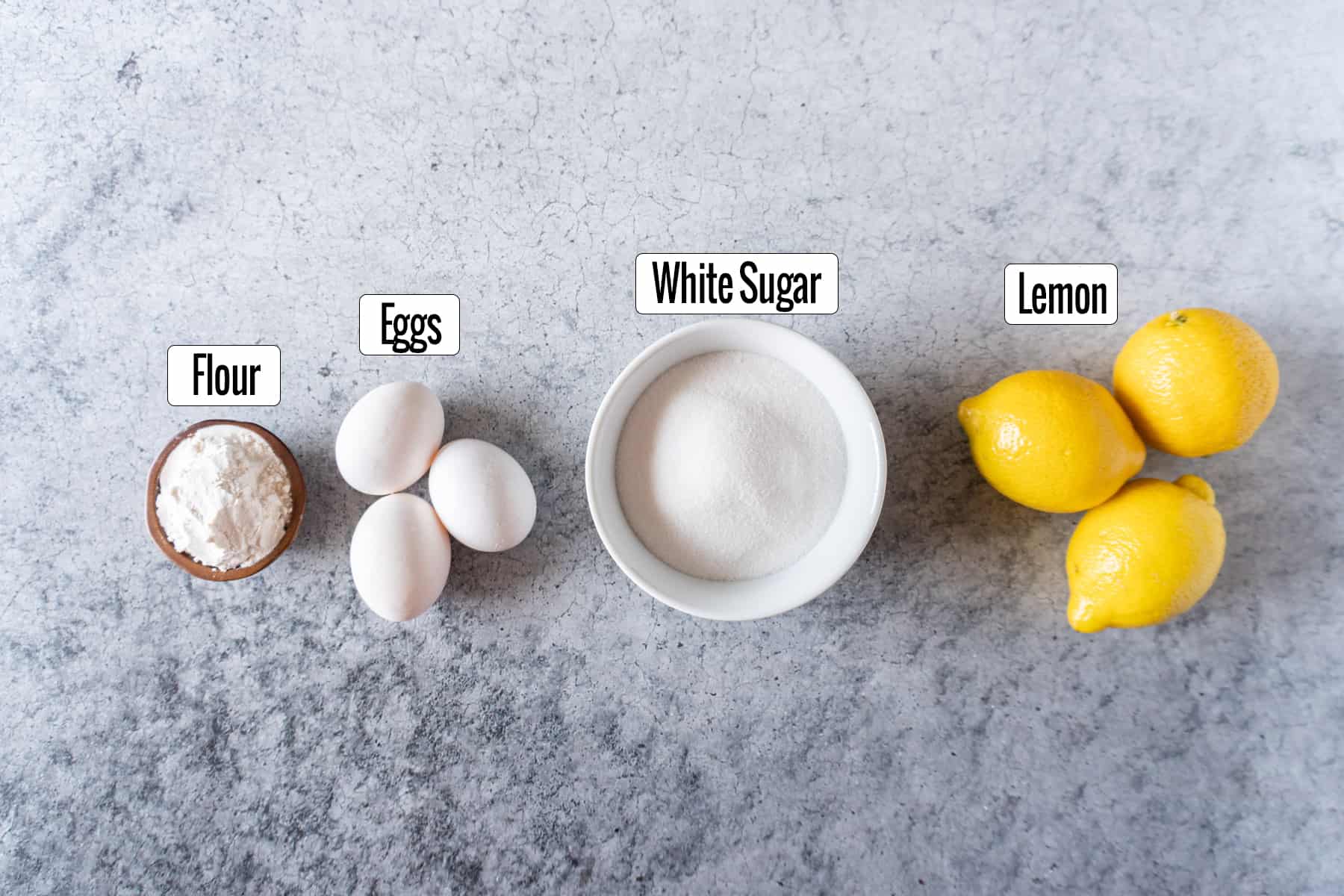 lemon bars ingredients- flour, eggs, sugar, lemons