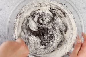 folding flour mixture into brownie batter