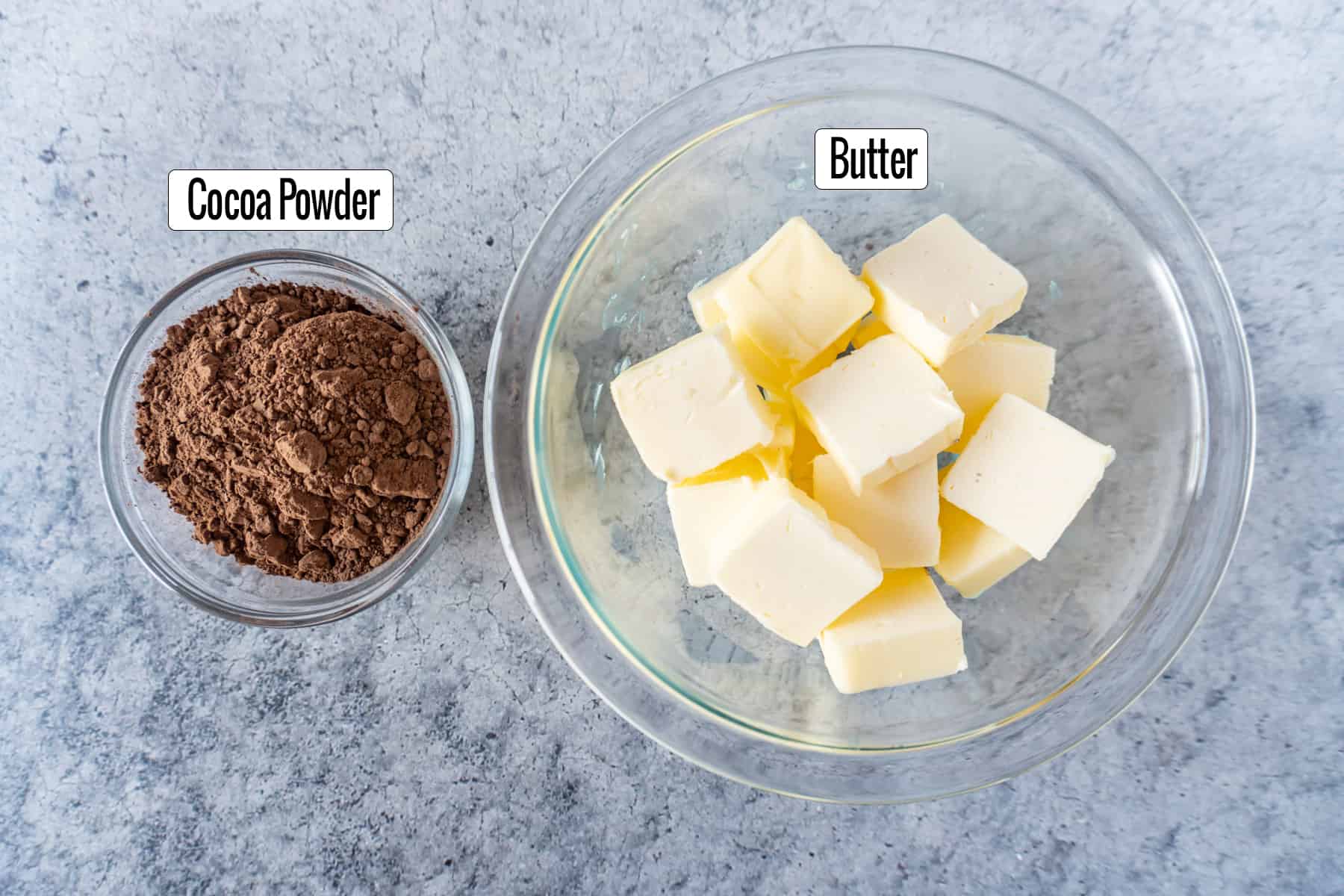 ingredients in bowls: cocoa powder, butter