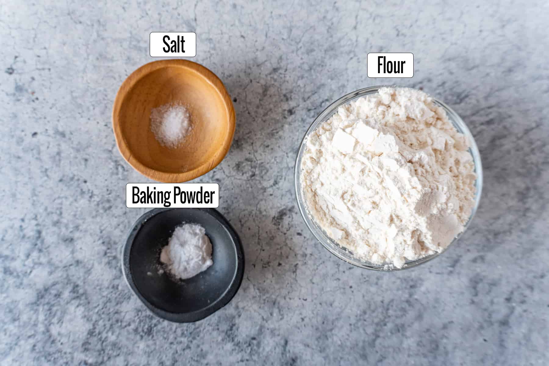 ingredients in bowls: salt. baking powder, flour