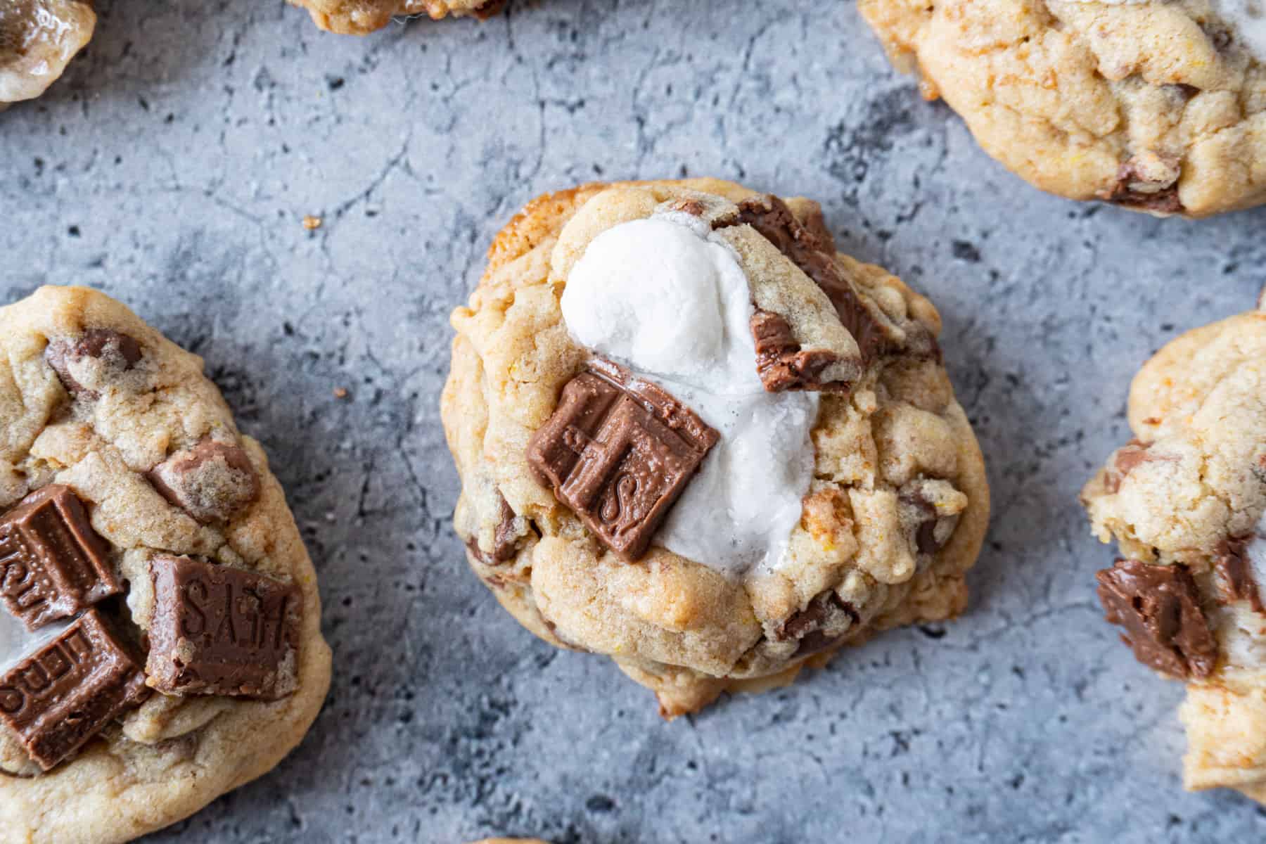 s'more cookies with melted marshmallow and chocolate on top