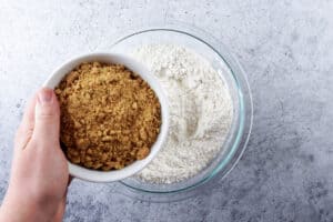 adding crushed graham cracker to the flour mixture