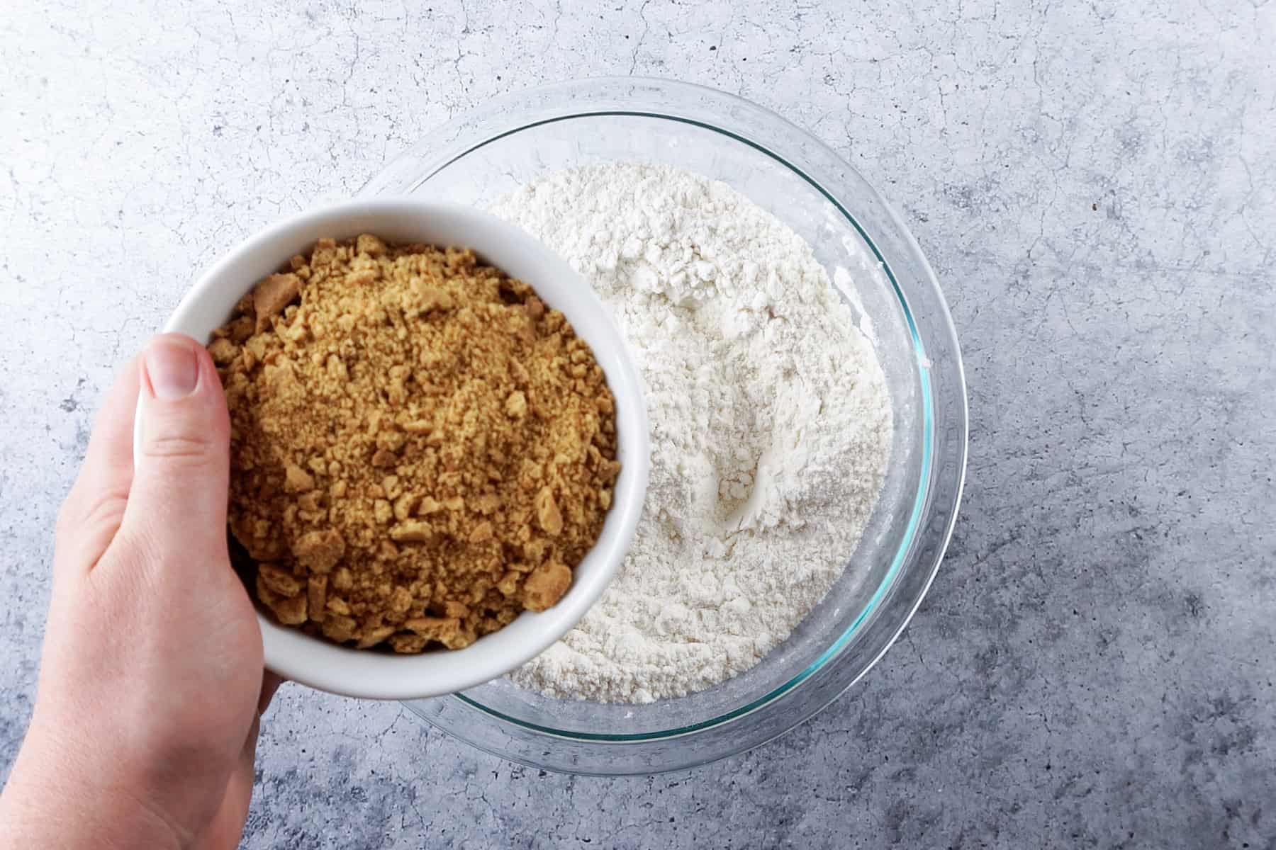 adding crushed graham cracker to the flour mixture