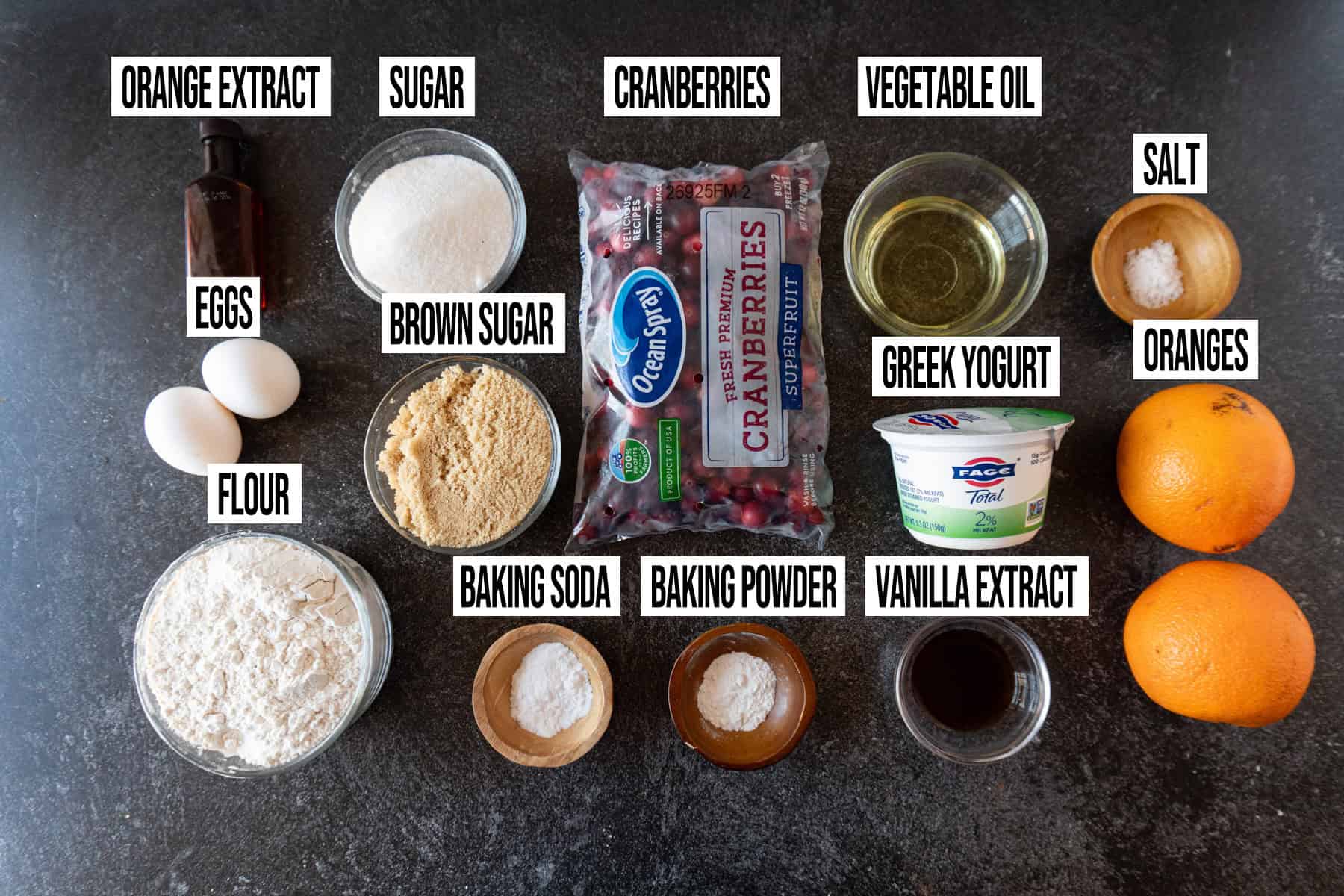 Cranberries Orange Muffins Ingredients in individual bowls and labeled.