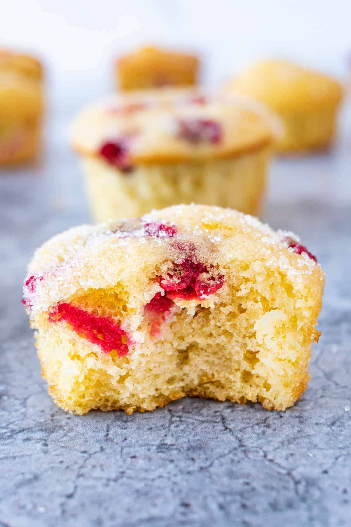 cranberry orange muffin with bite taken out