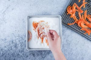 tossing candied grafefruit peel in sugar