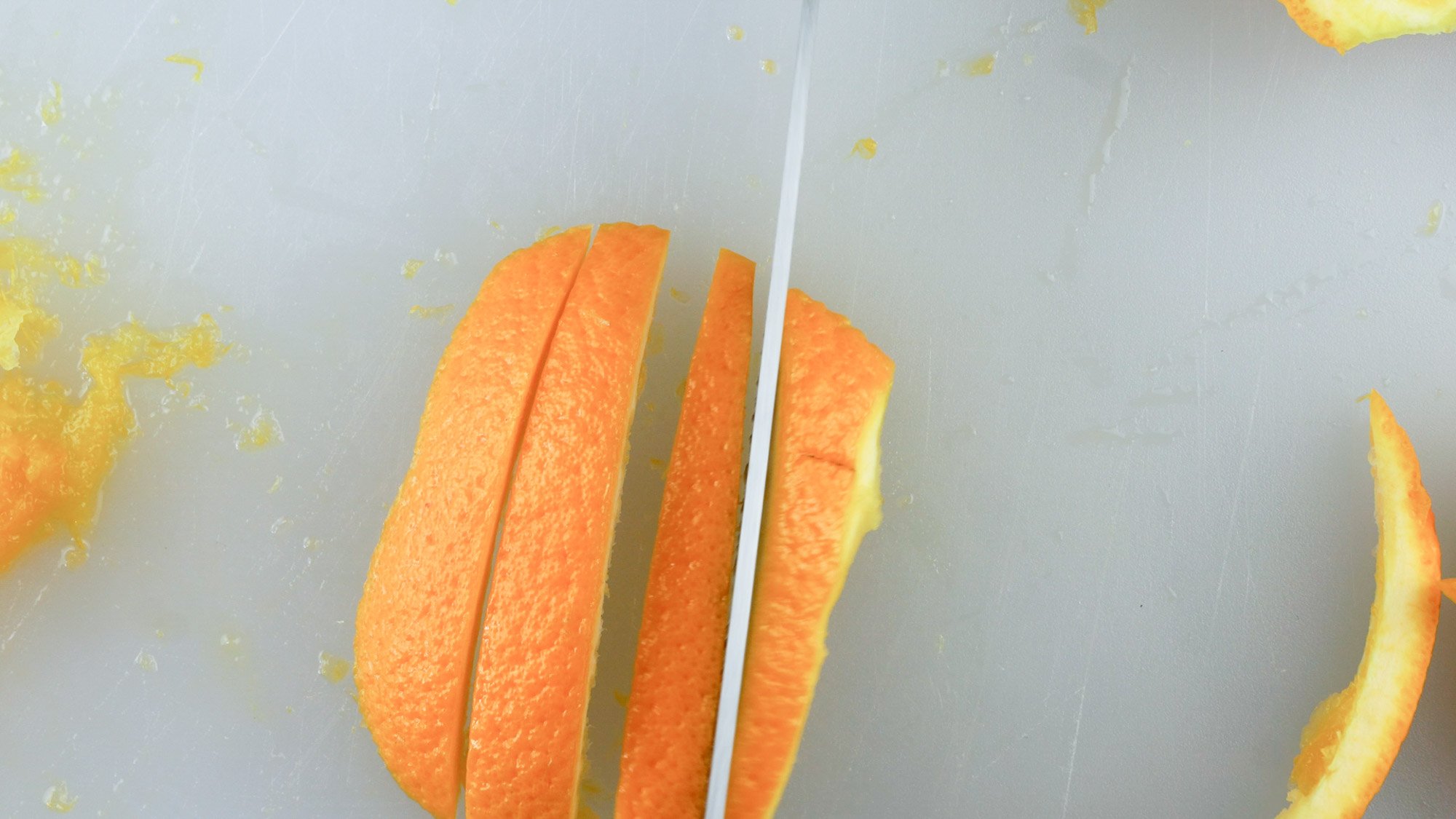 slicing orange peels