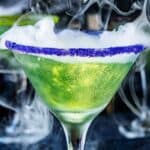 Bright Shimmery Green Drink with sugared purple rim close up