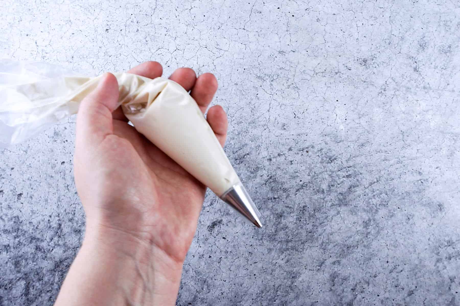 white candy melts in a piping bag.