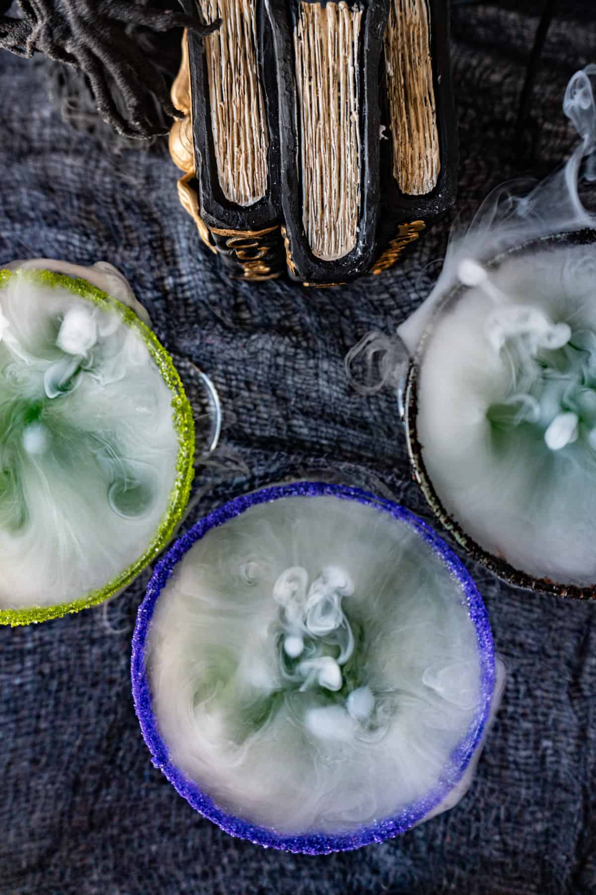 Witches Brew Cocktail image of top down of glasses with dry ice