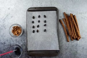 almonds painted with black frosting