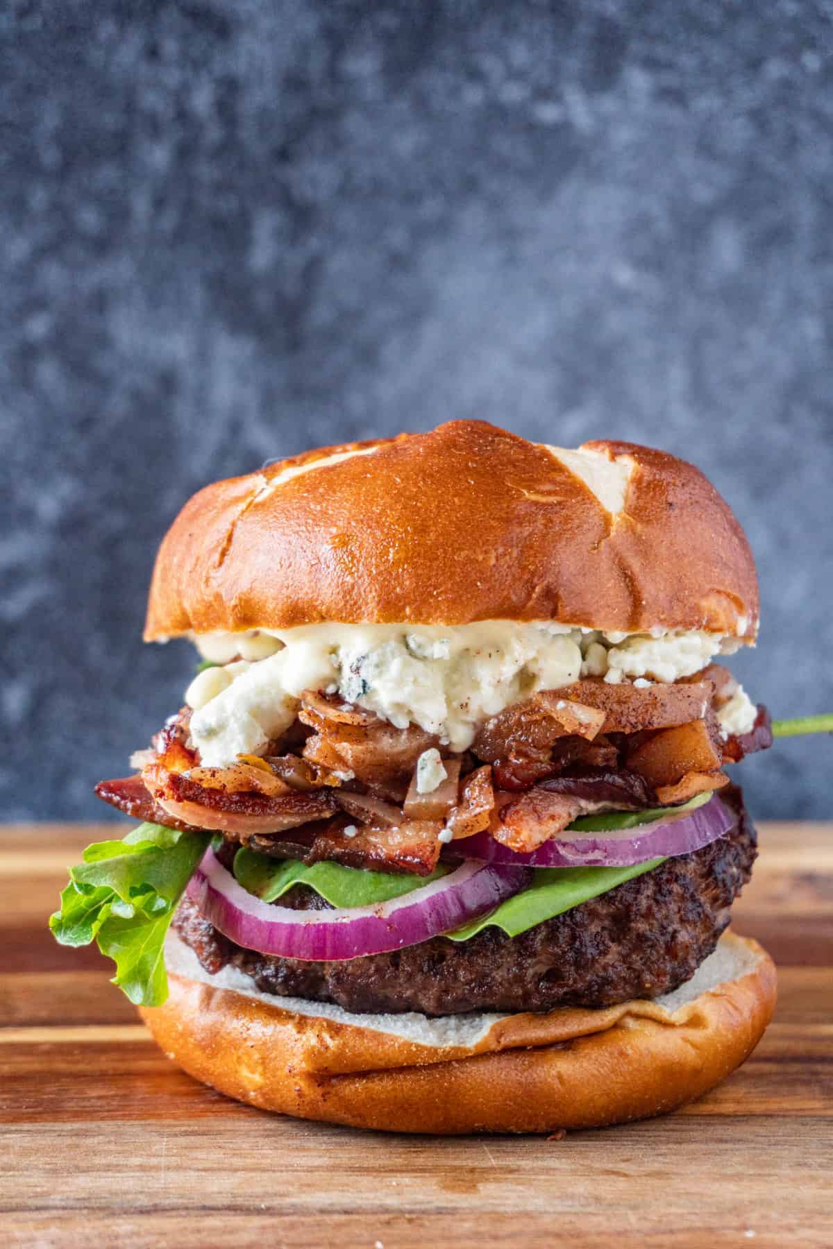 apple chutney blue cheese burger on cutting board