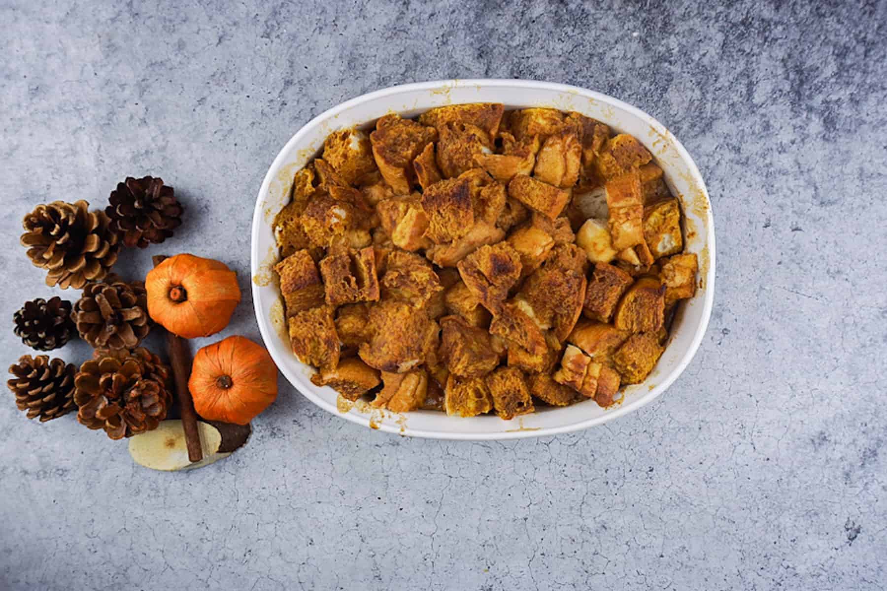 Pumpkin Bread pudding after being baked in a white dish.
