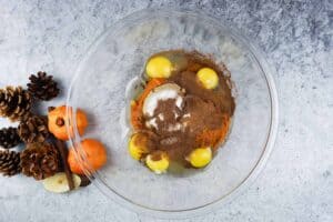 eegs, pumpkin, spices, and sugar in a bowl