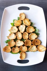 adding toasted bread over basil