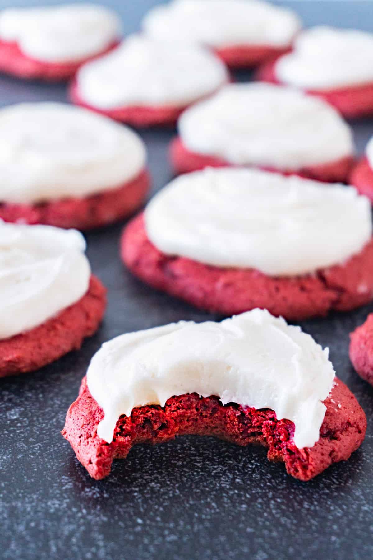 red velvet cake cookie with bite taken out