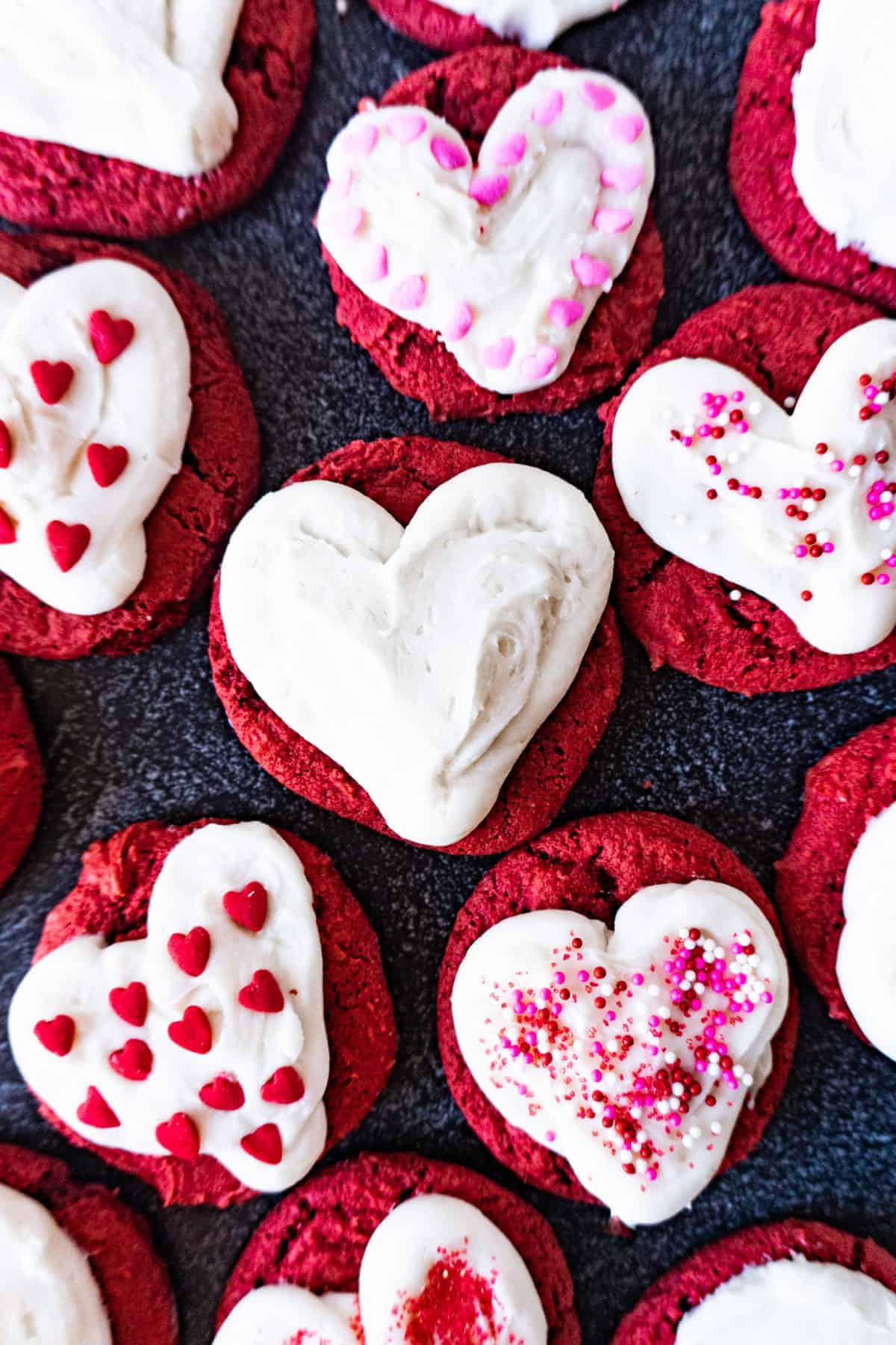 red velvet cookies with hearts piped on