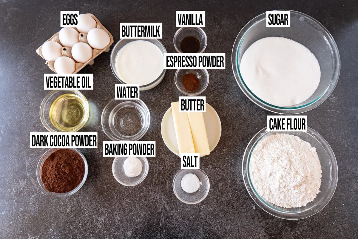 buttermilk chocolate cake ingredients are in individual bowls and labeled.