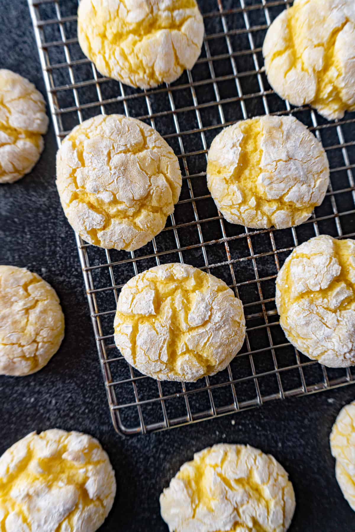 Lemon Crinkle cookies cooling on wire rack