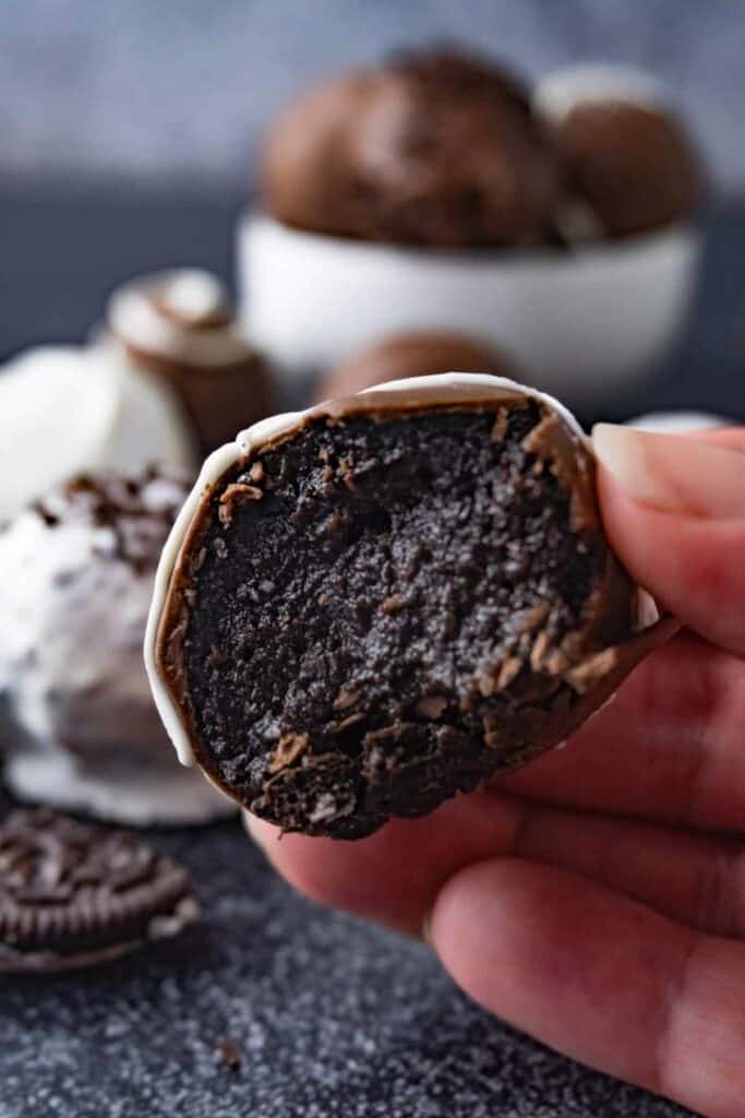 Oreo truffle with bite taken out showing truffle center