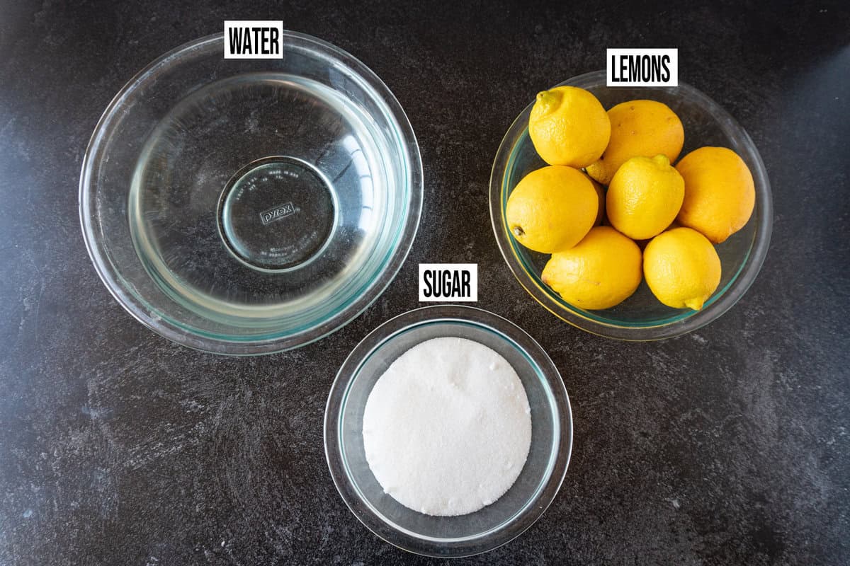 homemade lemonade recipe ingredients in individual bowls and labeled.