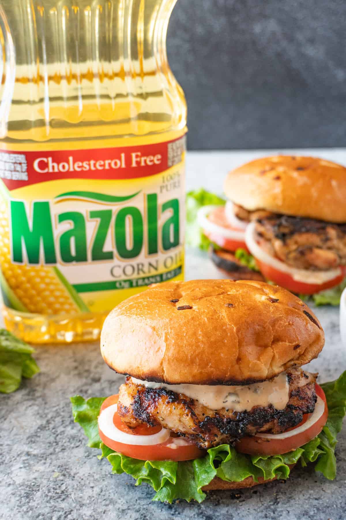 Grilled Chicken Sandwich with Mazola Corn Oil Bottle in background