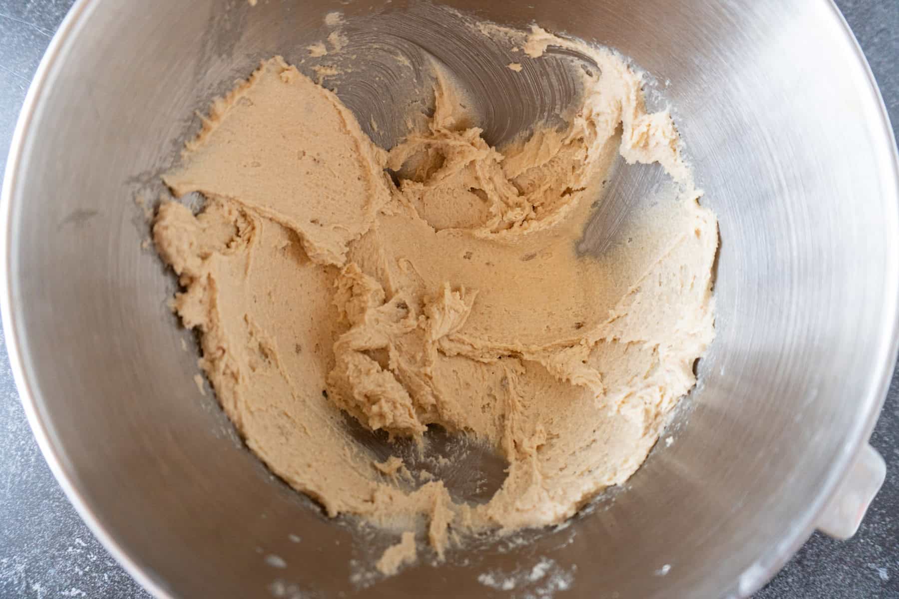butter and sugar mixed together in metal bowl.