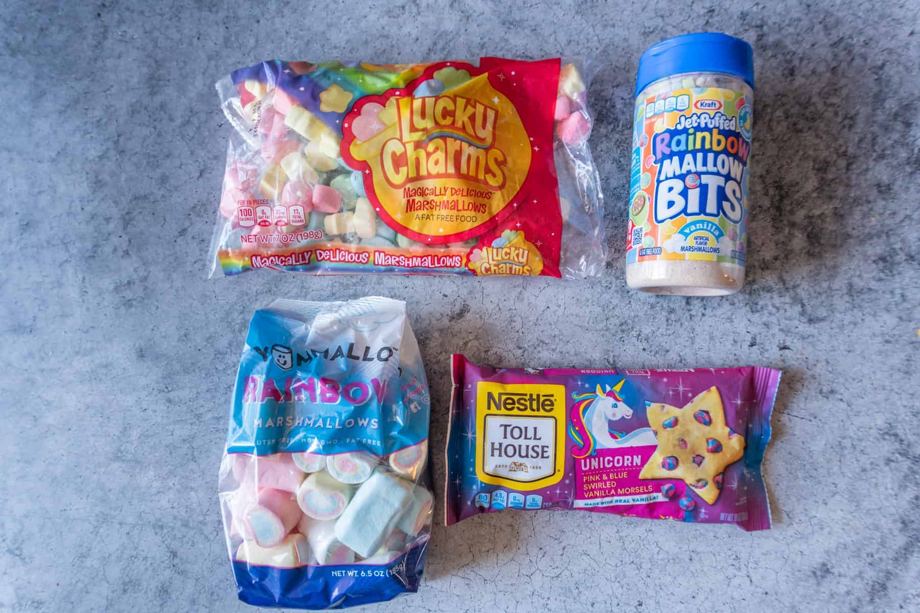 Lucky Charms Cookies are everything magical and super delicious! Filled with cereal bits, crunchy marshmallows, baked to perfection, and topped with gooey marshmallow! #atablefullofjoy #bakery #cookie #chewy #marshmallow #bestcookie #forkids #luckycharms #cereal #rainbow #tiedye #rainbow Lucky Charms Marshmallow Bits, Lucky Charms Large Marshmallows, Rainbow Marshmallows, Unicorn Chips