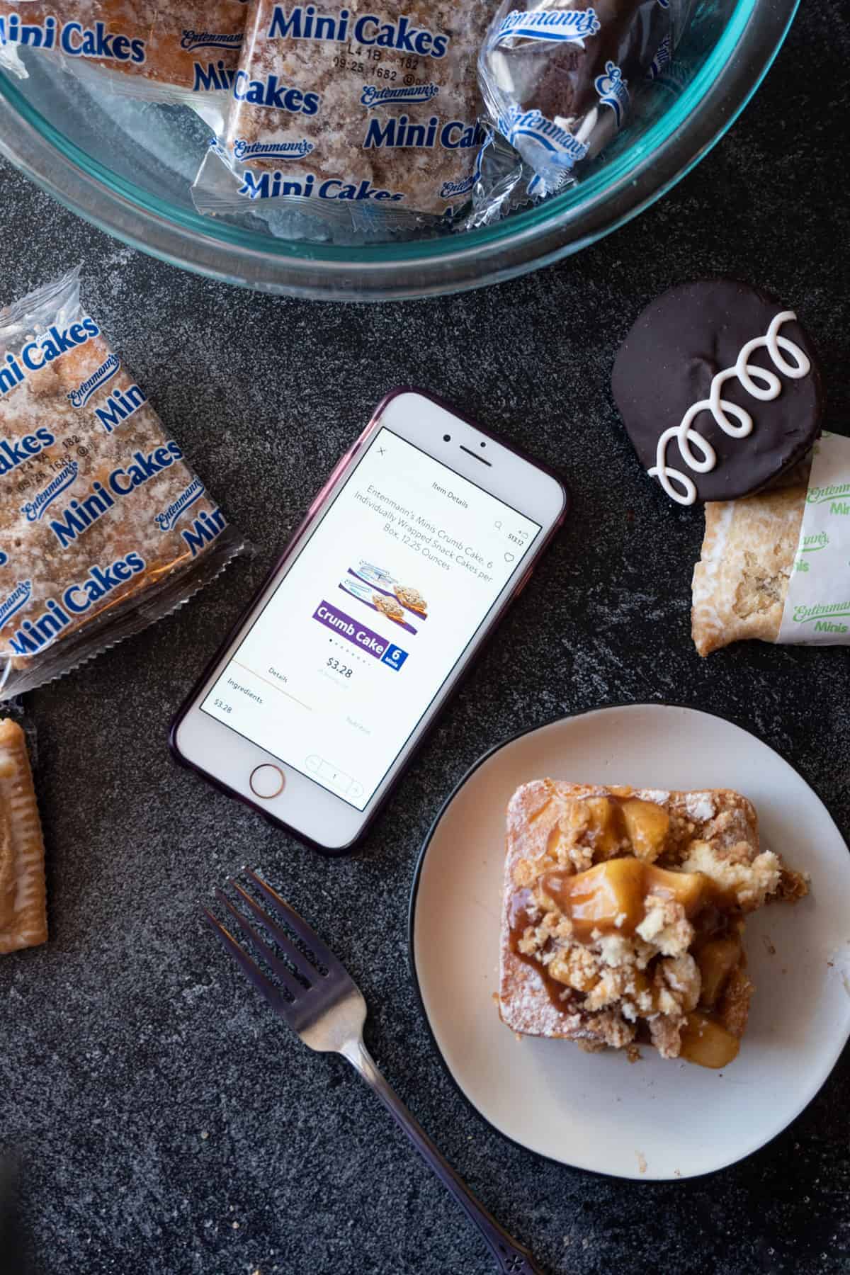 Phone with crumb cakes in online shopping cart