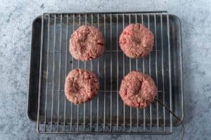 Patties on baking sheet