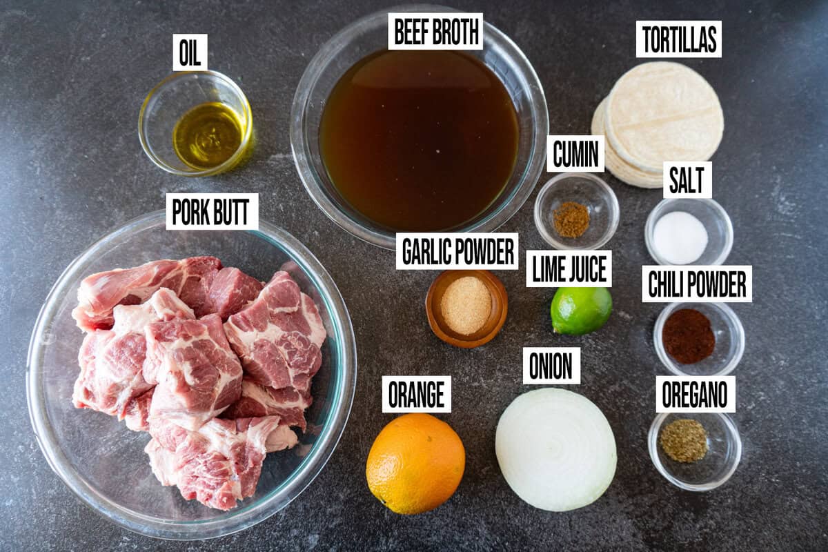pork carnitas ingredients in individual bowls and labeled.