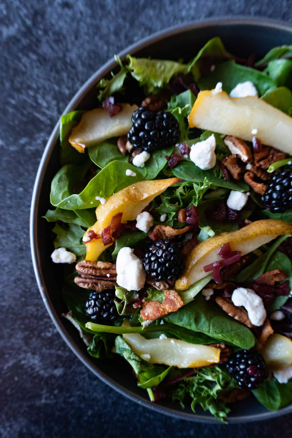 Salad in bowl with all the toppings on 