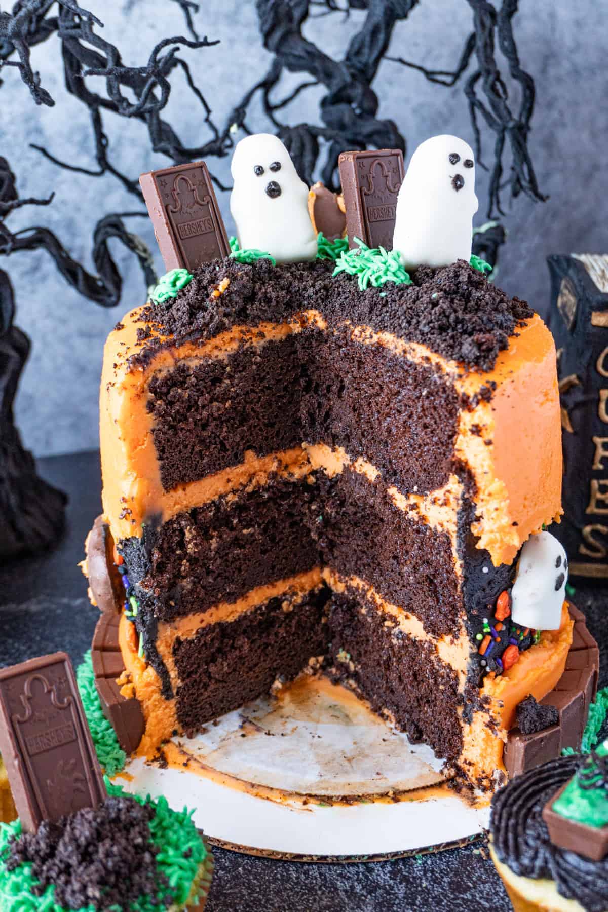 halloween graveyard cake with slice taken out