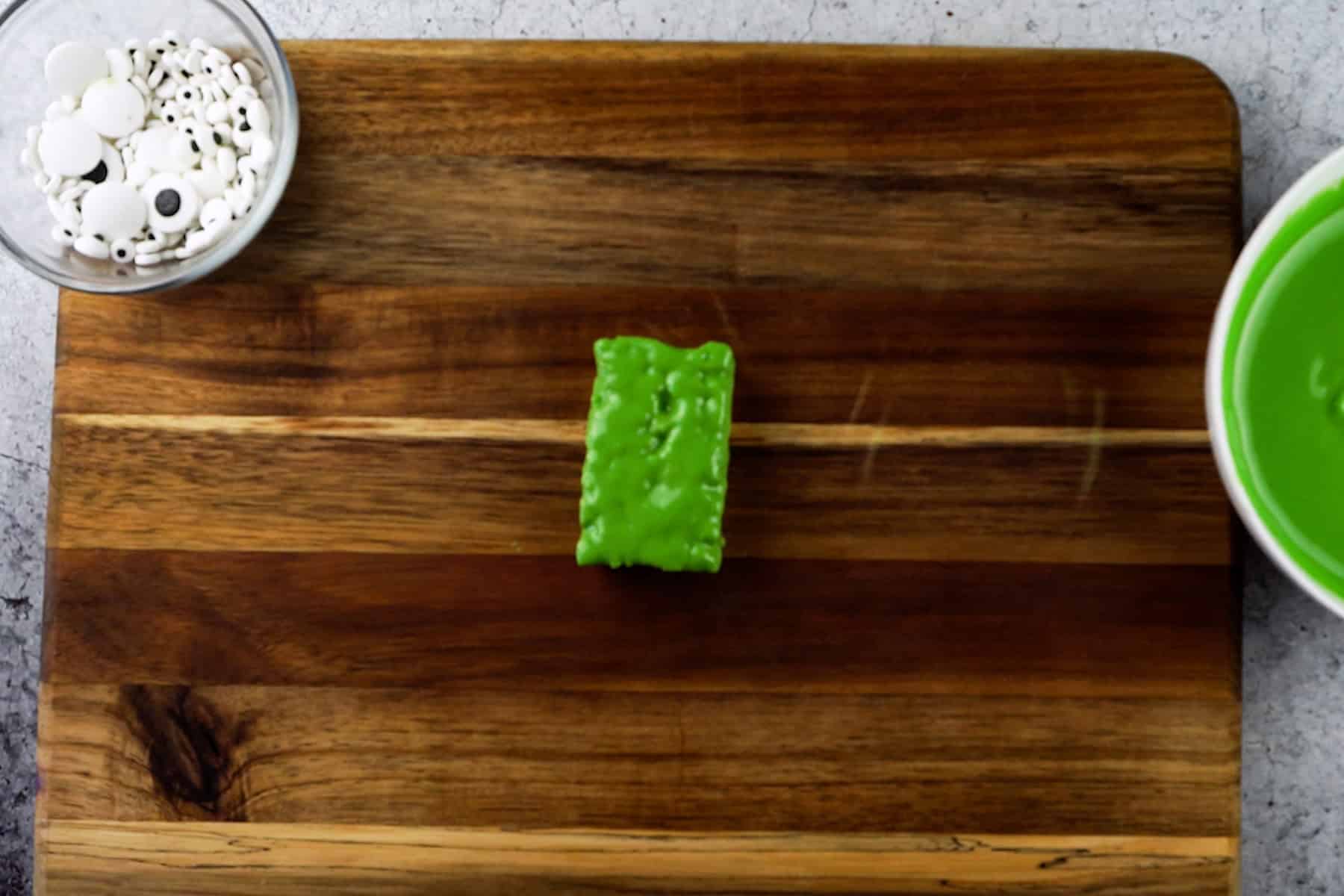 rice krispy rectangle dipped in green candy melts.